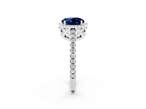 Silver Round Cut Blue Sapphire Halo Engagement Ring with Pavé Band and Prong Setting
