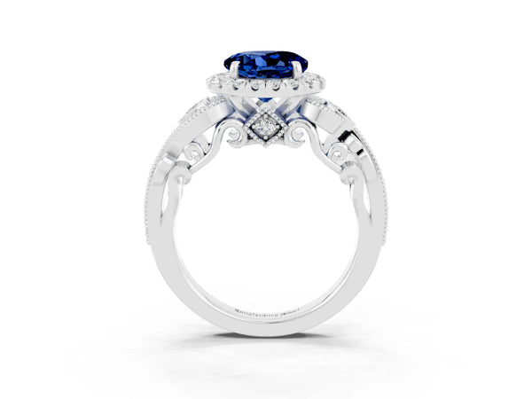 Platinum Round Cut Blue Sapphire Halo Ring with Milgrain Pavé Band and Four-Prong Setting