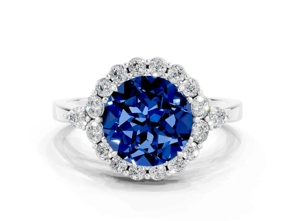 Platinum Round Cut Blue Sapphire Halo Ring with Pear Side Stones and Prong Setting