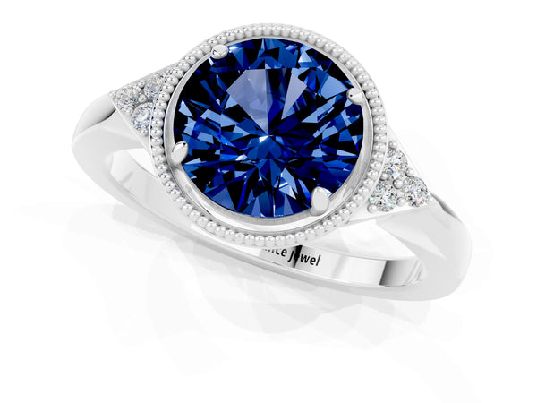 Silver Round Cut Blue Sapphire Halo Ring with Tapered Band and Four-Prong Setting