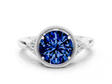 White gold Round Cut Blue Sapphire Halo Ring with Tapered Band and Four-Prong Setting