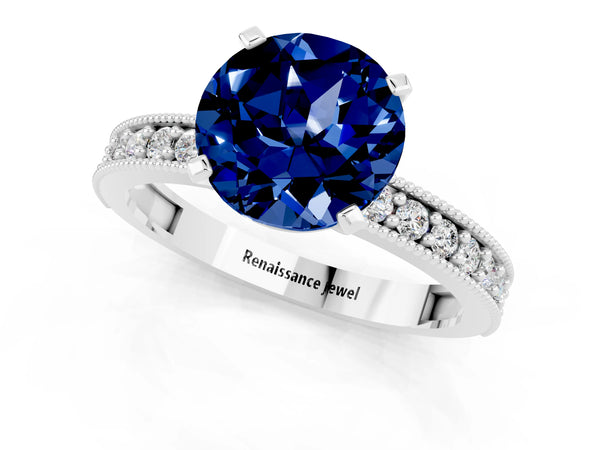 Silver Round Cut Blue Sapphire Milgrain Pavé Engagement Ring with Four-Prong Setting