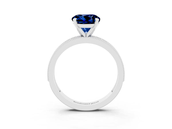 Silver Round Cut Blue Sapphire Milgrain Pavé Engagement Ring with Four-Prong Setting
