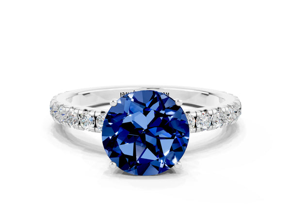 Platinum Round Cut Blue Sapphire Pavé Solitaire Engagement Ring with Four-Prong Setting