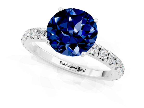 Silver Round Cut Blue Sapphire Pavé Solitaire Engagement Ring with Four-Prong Setting
