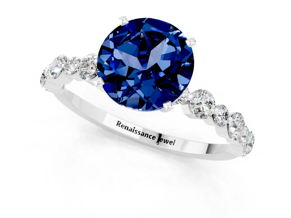 Platinum Round Cut Blue Sapphire Prong Set Engagement Ring with Pavé Band