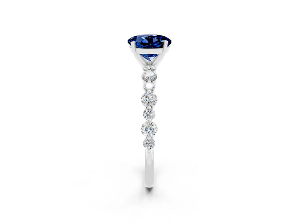 Silver Round Cut Blue Sapphire Prong Set Engagement Ring with Pavé Band