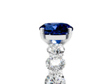 White gold Round Cut Blue Sapphire Prong Setting with Side Stones on a Pave Band_5
