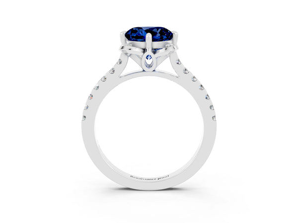 Silver Round Cut Blue Sapphire Ring with Pavé Band and Floral Prong Setting