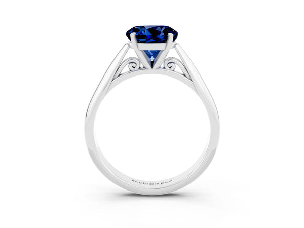 Silver Round Cut Blue Sapphire Solitaire Engagement Ring with Cathedral Setting and Four-Prong Mount