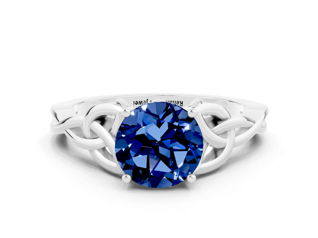 White gold Round Cut Blue Sapphire Solitaire Engagement Ring with Celtic Knot Band and Four-Prong Setting
