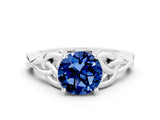 White gold Round Cut Blue Sapphire Solitaire Engagement Ring with Celtic Knot Band and Four-Prong Setting