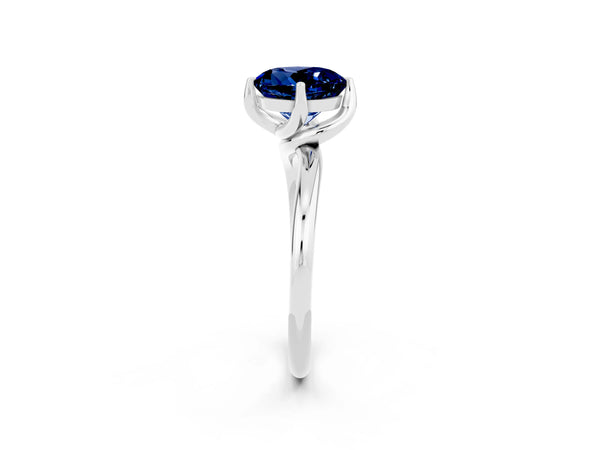 Platinum Round Cut Blue Sapphire Solitaire Engagement Ring with Four-Prong Setting and Classic Band