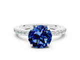 White gold Round Cut Blue Sapphire Solitaire Engagement Ring with Pavé Band and Four-Prong Setting