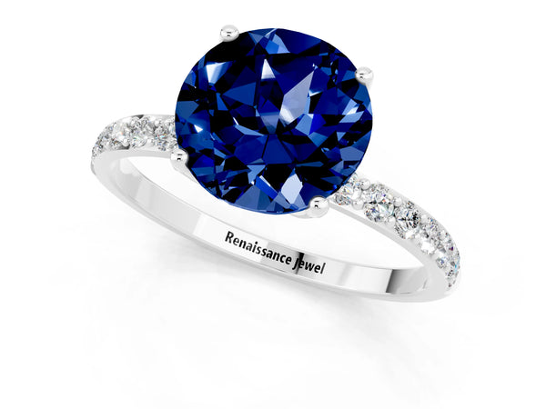Platinum Round Cut Blue Sapphire Solitaire Engagement Ring with Round  Pavé Band and Prong Setting