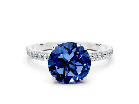 White gold Round Cut Blue Sapphire Solitaire Engagement Ring with Pavé Band and Prong Setting