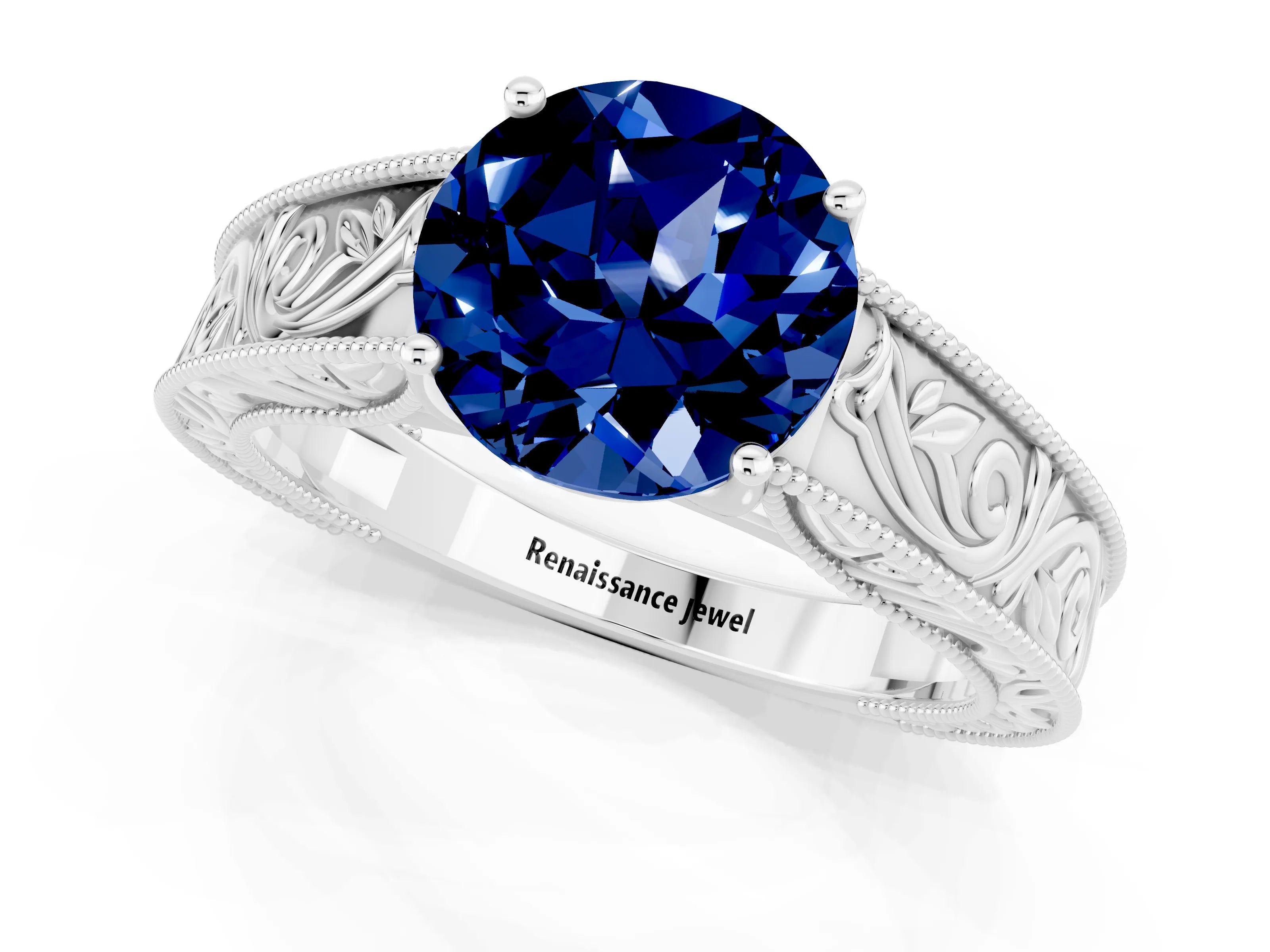White gold Round Cut Blue Sapphire Solitaire Ring with Engraved Band and Four-Prong Setting_1