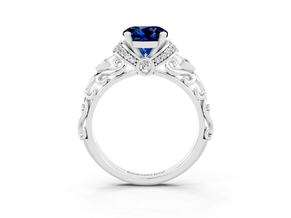 Platinum Round Cut Blue Sapphire Solitaire Ring with Filigree Band and Four-Prong Setting