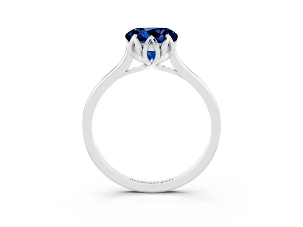 Platinum Round Cut Blue Sapphire Solitaire Ring with Flower Prong Setting and Classic Band
