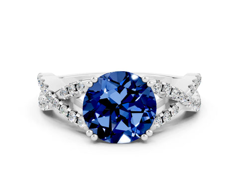 White gold Round Cut Blue Sapphire Solitaire Ring with Four-Prong Setting and Twisted Pavé Band
