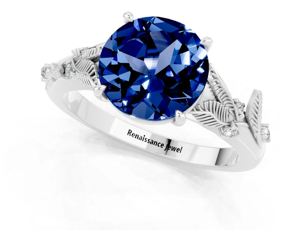 Platinum Round Cut Blue Sapphire Solitaire Ring with Leaf Motif Band and Four-Prong Setting