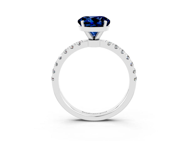 Silver Round Cut Blue Sapphire Solitaire Ring with Pavé Accents and Four-Prong Setting