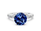 White gold Round Cut Blue Sapphire Solitaire Ring with Pavé Accents and Four-Prong Setting