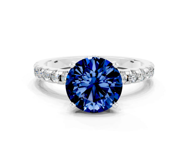 Silver Round Cut Blue Sapphire Solitaire Ring with Round  Pavé Band and Four-Prong Setting