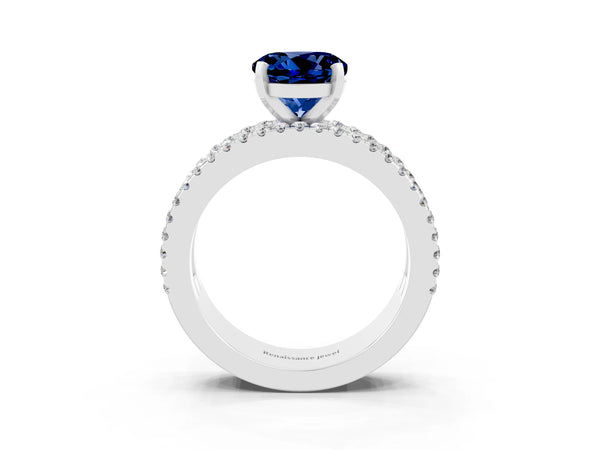 Platinum Round Cut Blue Sapphire Solitaire Ring with Pavé and Channel Set Band