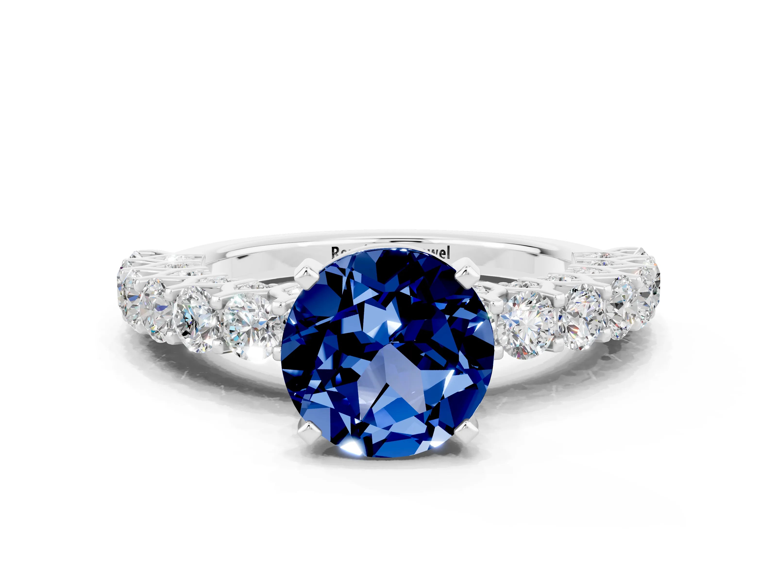 White gold Round Cut Blue Sapphire Solitaire Ring with Shared Prong Pavé Band and Four-Prong Setting