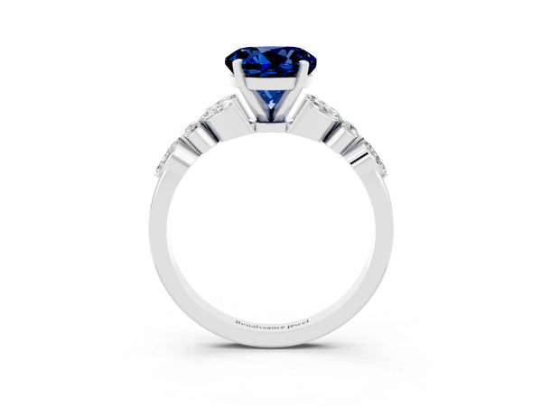 Platinum Round Cut Blue Sapphire Solitaire Ring with Side Stones and Four-Prong Setting
