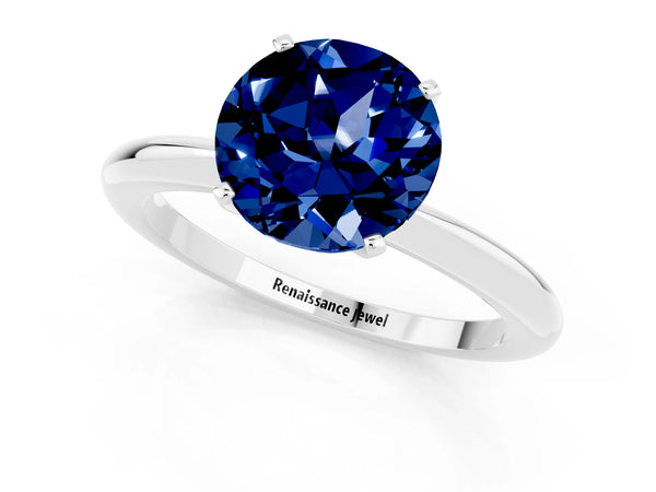 Silver Round Cut Blue Sapphire Solitaire Ring with Six-Prong Setting and Classic Band