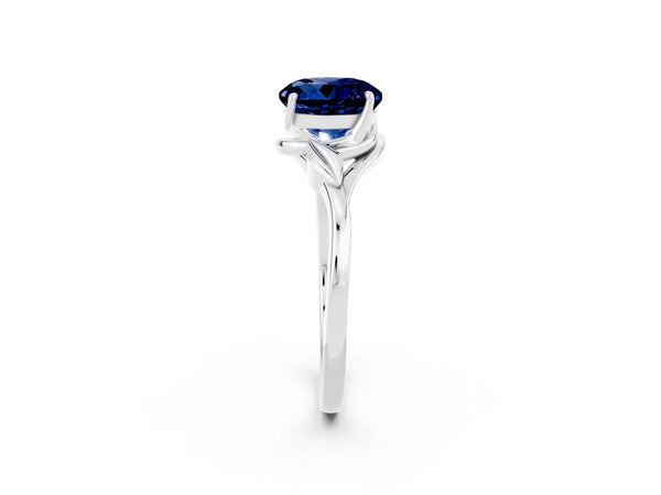 Platinum Round Cut Blue Sapphire Solitaire Ring with Twist Band and Four-Prong Setting