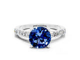 White gold Round Cut Blue Sapphire Solitaire with Side Baguettes and Channel Set Band