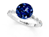 White gold Round Cut Blue Sapphire Solitaire with Side Stones on a Pavé Band and Four-Prong Setting_1