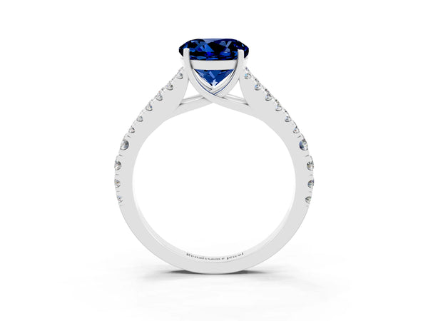 Silver Round Cut Blue Sapphire Split Shank Pavé Engagement Ring with Four-Prong Setting