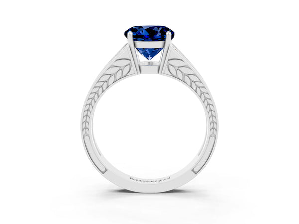 Platinum Round Cut Blue Sapphire Split Shank Ring with Pavé Band and Four-Prong Setting