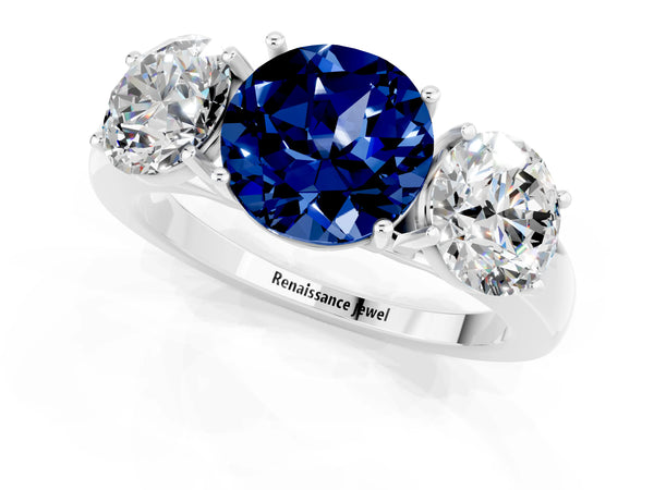 Platinum Round Cut Blue Sapphire Three-Stone Ring with Four-Prong Setting and Classic Band