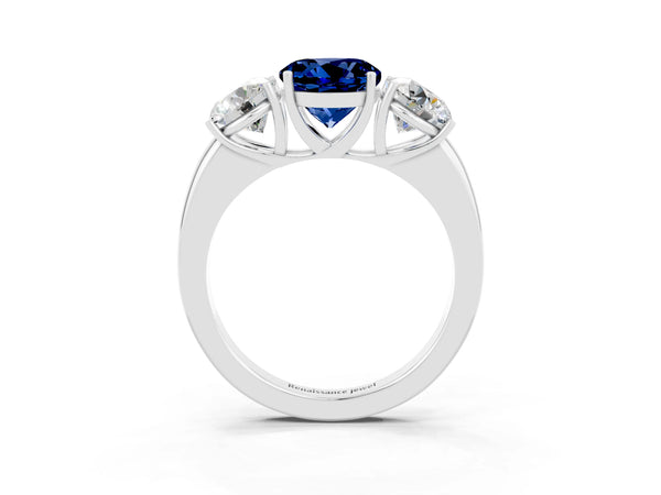 Platinum Round Cut Blue Sapphire Three-Stone Ring with Four-Prong Setting and Classic Band