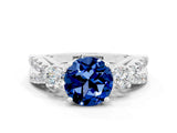 White gold Round Cut Blue Sapphire Three-Stone Ring with Pavé Split Shank and Four-Prong Setting