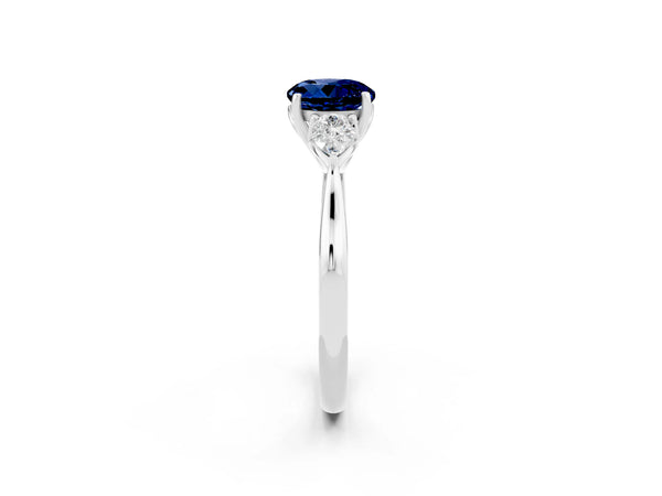 Platinum Round Cut Blue Sapphire Three-Stone Ring with Pear  Side Stones and Prong Setting