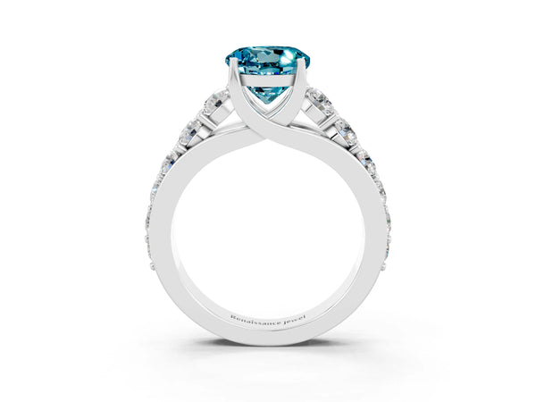 Platinum Round Cut Blue Topaz Engagement Ring with Pavé Band and Four-Prong Setting