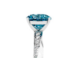 White gold Round Cut Blue Topaz Engagement Ring with Side Stone Accents and Four-Prong Setting_65