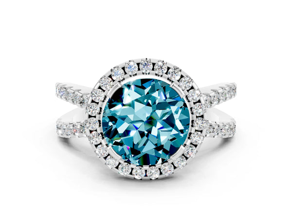 Platinum Round Cut Blue Topaz Halo Ring with Split Shank Pavé Band and Prong Setting