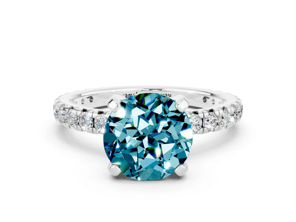 Platinum Round Cut Blue Topaz Pavé Solitaire Ring with Round Band and Prong Setting