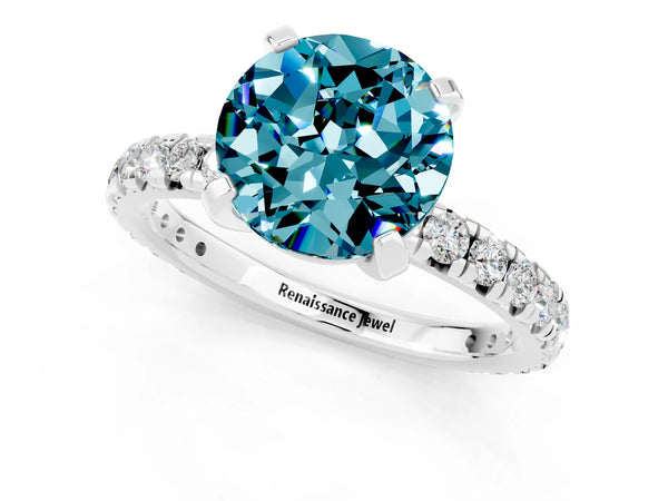 Platinum Round Cut Blue Topaz Pavé Solitaire Ring with Round Band and Prong Setting