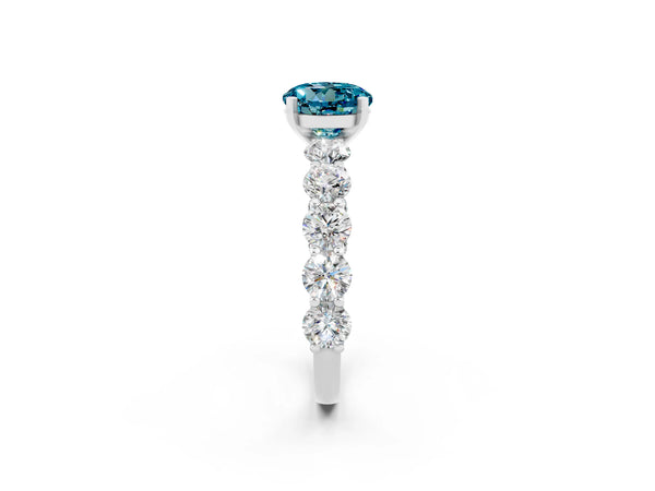 Silver Round Cut Blue Topaz Prong Setting with Side Stones on a Pave Band