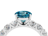 White gold Round Cut Blue Topaz Prong Setting with Side Stones on a Pave Band_4