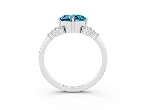 Silver Round Cut Blue Topaz Ring with Side Stones and Four-Prong Setting