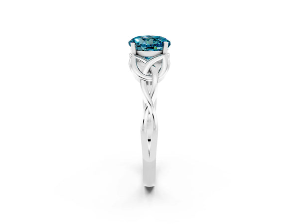 White gold Round Cut Blue Topaz Solitaire Engagement Ring with Celtic Knot Band and Four-Prong Setting